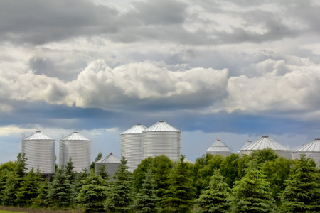 Grain storage bins owned by wheat farmers in rural Saskatchewan Canadaの写真素材