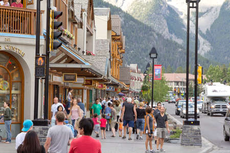Tourists walking around in the town of Banffのeditorial素材