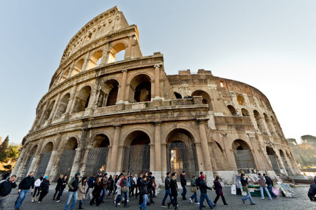 People walking around the Colosseum in Rome, Italyのeditorial素材