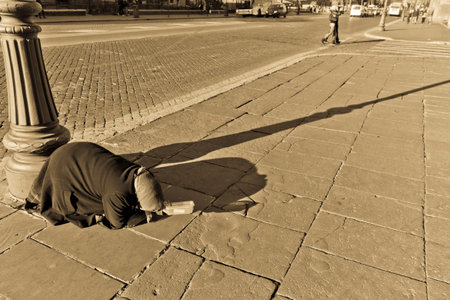 A woman panhandler begging for money on the streets of Romeのeditorial素材
