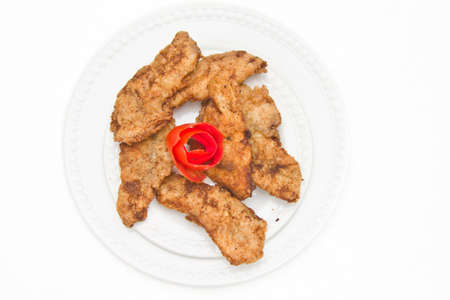 Fried Fish Fillet decorated with tomato pealingの写真素材