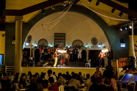 Spectacular show at an outdoor stage in Hammamet, Tunisia, where Local talent showcase their extraordinary ability to breathe fire like the mystical fire breathing dragons.のeditorial素材