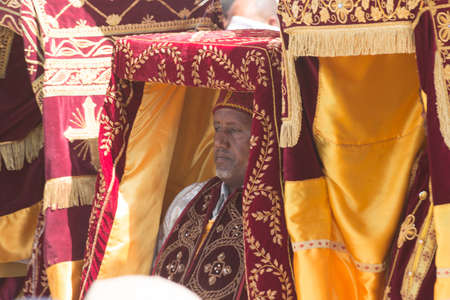 ADDIS ABABA, ETHIOPIAâ JANUARY 19: Priests carry the Tabot, a model of the Arc of Covenant, back to its church, during a colorful procession of Timket celebrations of Epiphany, commemorating the baptism of Jesus in the river of Jordan, on January 19, 20のeditorial素材