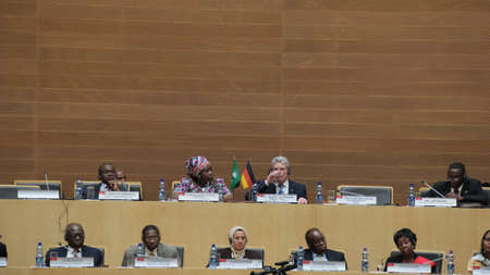 Addis Ababa, Ethiopia â March 18: German President Joachim Gauck drinks a glass of water after delivering a long speech to the Council of Permanent Representatives of the AU in Addis Ababa, Ethiopia on March 18, 2013のeditorial素材