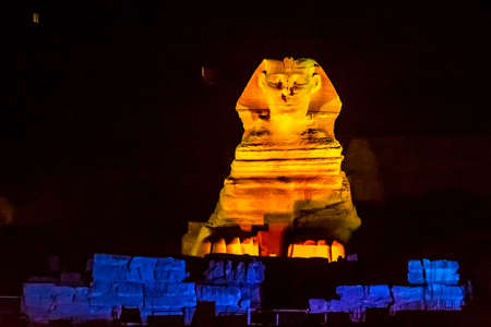Sphinx of Giza in Egypt lit by spot lights in the evening during the light and sound showの写真素材