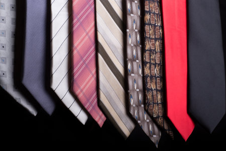 An assortment of different colorful neckties each with a different style and patternの写真素材