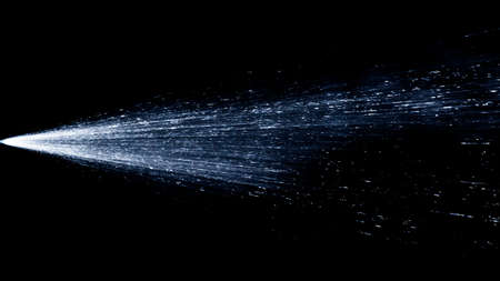 An image of water as it it sprayed out of the nozzle of a spray bottleの写真素材