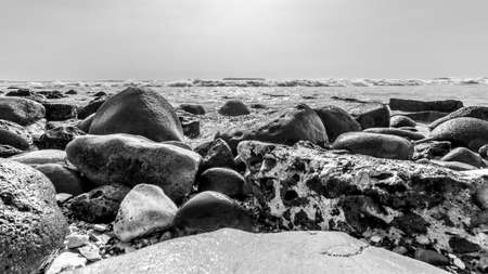 The beautiful waters of the Atlantic ocean with its rocky coastline near the City of Dakar in Senegalの写真素材