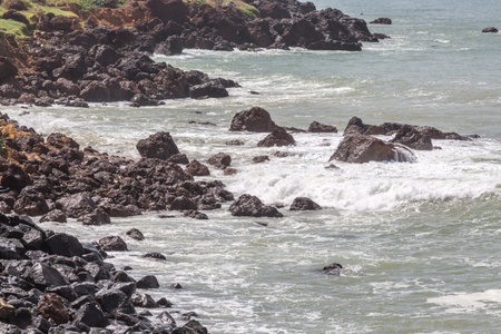 The beautiful waters of the Atlantic ocean with its rocky coastline near the City of Dakar in...