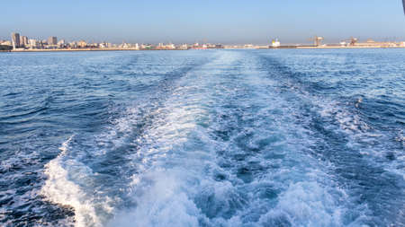The beautiful waters of the Atlantic ocean with its rocky coastline near the City of Dakar in Senegalの写真素材