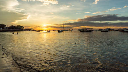 Sun setting the shores of the Indian Ocean in Zanzibar, Tanzaniaの写真素材