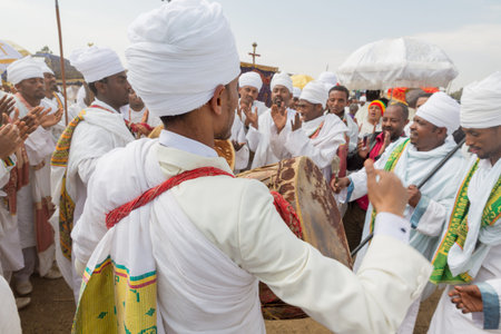 Clergymen sing and chant with kebero, a traditional drum made out of animal hide, while accompanying...