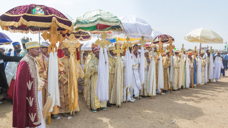 Priests carry large crosses in front of the Tabot, a model of the arc of covenant, during a colorful...