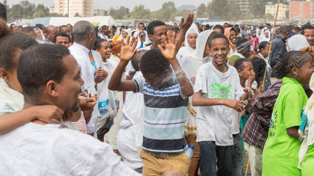 Holy water is sprayed onto the crowd attending Timket celebrations of Epiphany, commemorating the...