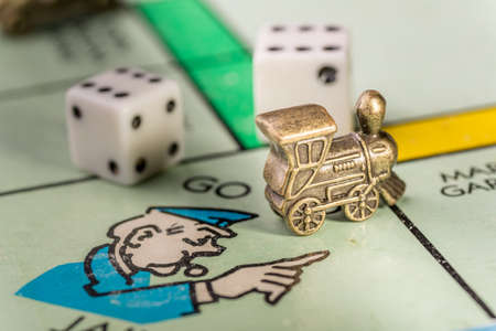 The train monopoly piece landing on go to jail space of a monopoly boardのeditorial素材
