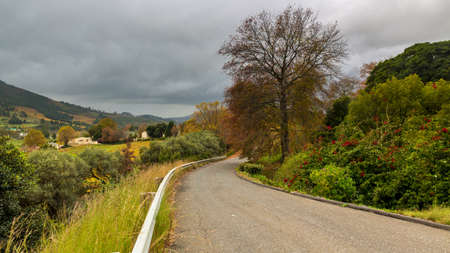 A small asphalt road cutting through the picturesque landscapes of the Western Cape regions of South Africaの写真素材