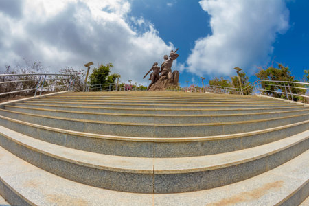 African Renaissance Monument, a 49 meter tall bronze statue of a man, woman and child, in Dakar, Senegalの写真素材