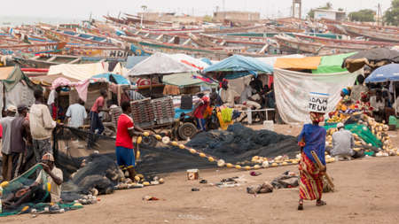 Mbour, Senegal - July, 2014: Fishermen set up their nets to go back to the see at the local fish market in Mbour on July 9, 2014 in Mbour, Senegal.のeditorial素材