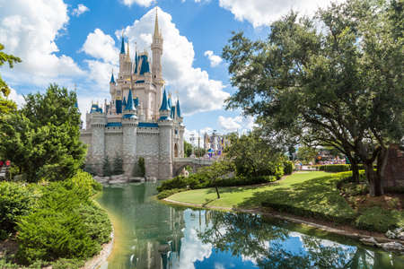 Orlando, Florida - Sept 4: The famous Disney Magic Kingdom Castle and its mirror reflection on the calm waters surrounding the castle in Orlando, Florida, on September 4, 2014のeditorial素材