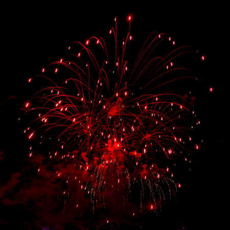 A close-up shot of sparkling Fireworks bursting out into beautiful shapesの写真素材