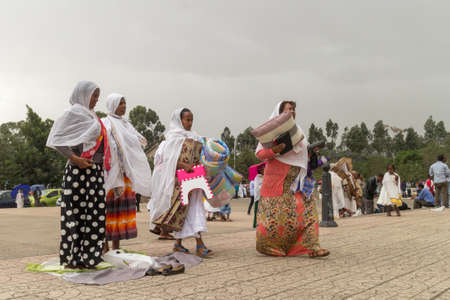 Addis Ababa: April 10: Devoted Ethiopian Orthodox followers observe Siklet, the crucifixion of Jesus Christ, at Bole Medhane Alem Church on April 10 ,2015 in Addis Ababa, Ethiopiaのeditorial素材