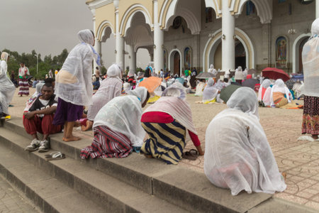 Addis Ababa: April 10: Devoted Ethiopian Orthodox followers bow down hundreds of times to worship God, and remember the pain and suffering of Jesus Christ, during Siklet (crucifixion) on April 10 ,2015 in Addis Ababa, Ethiopiaのeditorial素材