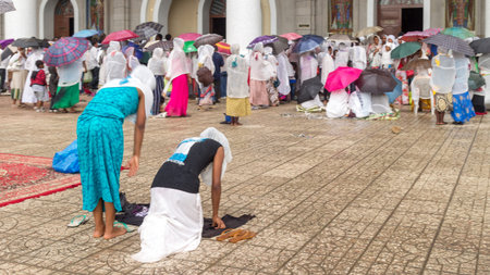 Addis Ababa: April 10: Devoted Ethiopian Orthodox followers bow down hundreds of times to worship God, and remember the pain and suffering of Jesus Christ, during Siklet (crucifixion) on April 10 ,2015 in Addis Ababa, Ethiopiaのeditorial素材