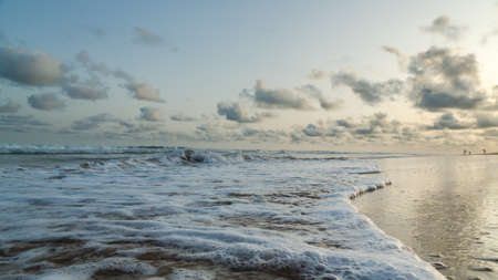 Waves of the Atlantic Ocean landing on the shores of Obama Beach in Cotonou, Beninの写真素材