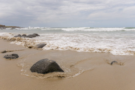 Waves of the Atlantic ocean hitting the beaches along the shores of Dakar, Senegalの写真素材