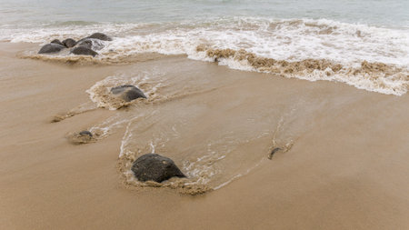 Waves of the Atlantic ocean hitting the beaches along the shores of Dakar, Senegalの写真素材