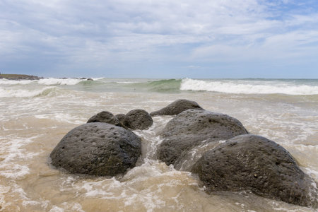 Waves of the Atlantic ocean hitting the beaches along the shores of Dakar, Senegalの写真素材