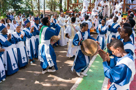 ADDIS ABABA, ETHIOPIA - May 21: A young member of the Ethiopian Orthodox Church Choir sing and chant accompanied by a drum during a colorful procession on May 21, 2016 in Addis Ababa, Ethiopiaのeditorial素材