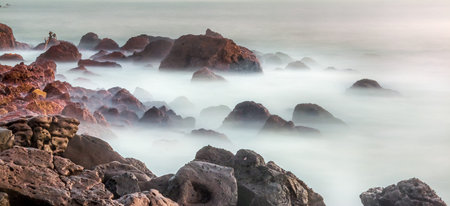 The beautiful waters of the Atlantic ocean with its rocky coastline near the City of Dakar in...