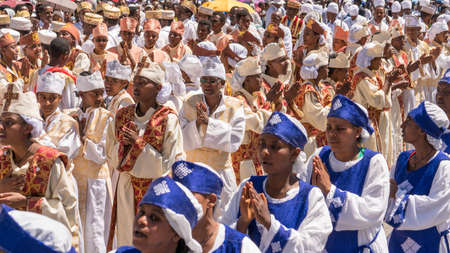 Addis Ababa - Jan 19: Ethiopian Orthodox Clergy and followers sing and chant while accompanying the Tabot, a model of the arc of covenant, during a colorful procession which is part of Timket celebrations of Epiphany, on JJanuary 19, 2017 in Addis Ababa, のeditorial素材