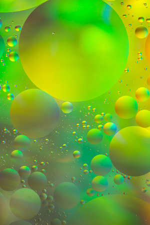 Yellow and green, psychedelic oil and water abstractの写真素材