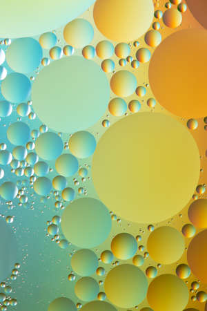 Blue, yellow and gold, oil and water abstractの写真素材