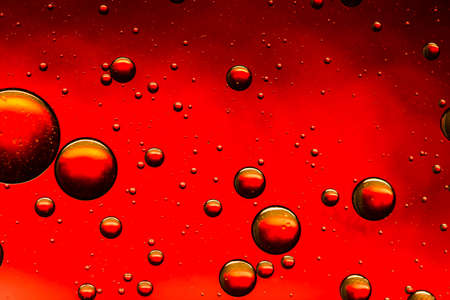 Vivid red oil and water abstractの写真素材