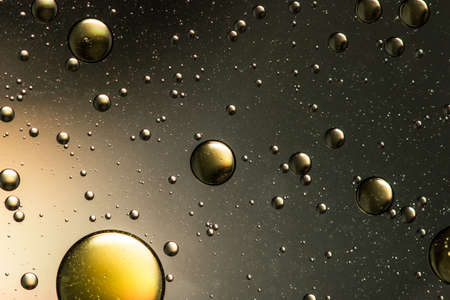 Black and gold oil and water abstractの写真素材