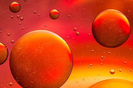 Yellow, orange and red oil and water abstract backgroundの写真素材