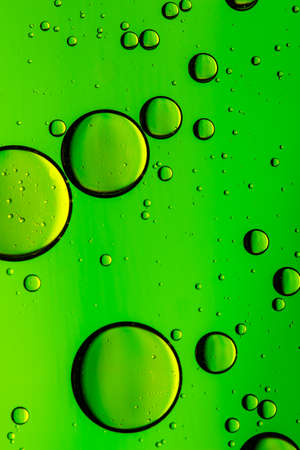 Vivid green oil and water abstract backgroundの写真素材