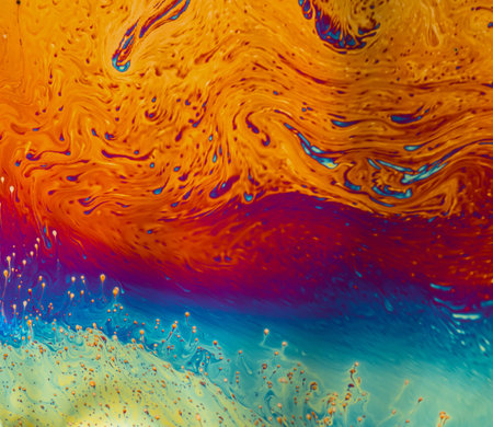 Psychedelic patterns formed on the surface of soap bubbles