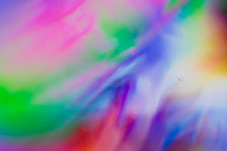 Colorful psychedelic blur showing stress distribution in plastic using polarized lightの写真素材