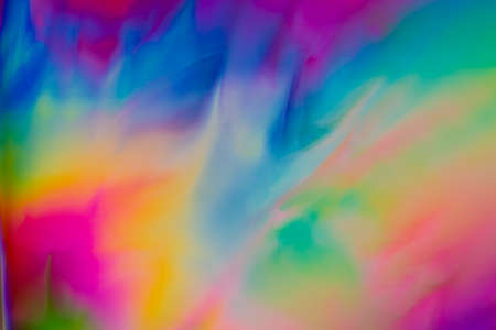 Colorful psychedelic blur showing stress distribution in plastic using polarized lightの写真素材