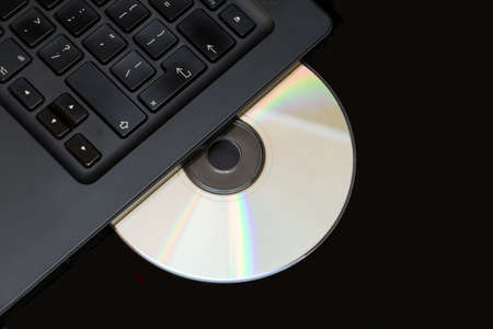 Selective focus cd or dvd in laptop driveの写真素材