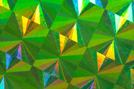 Psychedelic abstract formed by light reflecting off a textured metal surfaceの写真素材