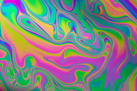 Psychedelic abstract formed by light on the surface of a soap bubbleの写真素材