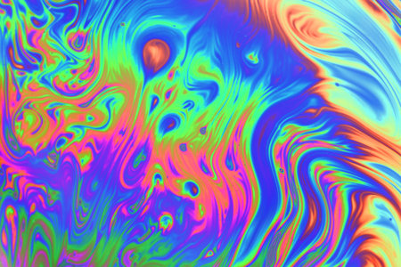 Psychedelic abstract formed by a soap bubble reflecting lightの写真素材
