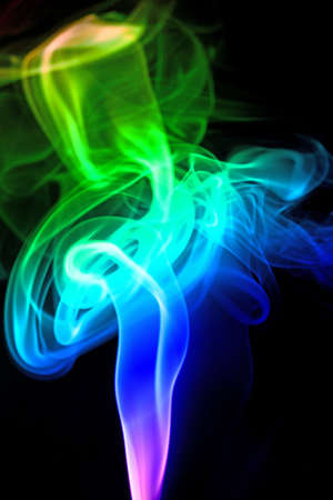 Colored smoke isolated on a black backgroundの写真素材