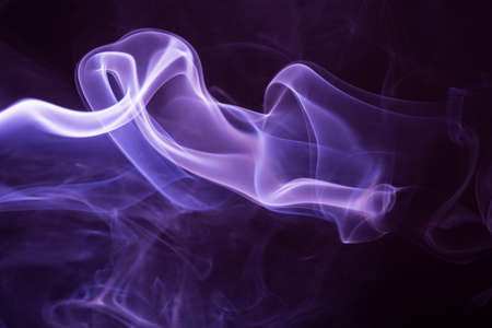 Colored smoke isolated on a black backgroundの写真素材