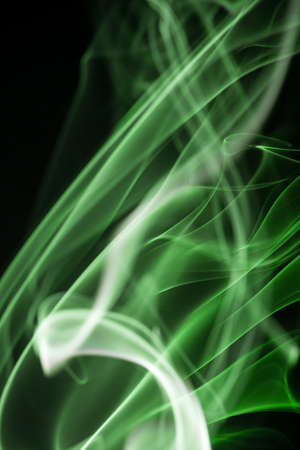 Colored smoke isolated on a black backgroundの写真素材